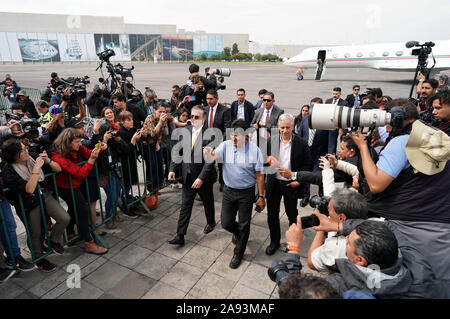 Mexico City, Mexico. 12th Nov, 2019. Evo Morales (C) arrives at the airport in Mexico City, capital of Mexico, on Nov. 12, 2019. Evo Morales, who had been offered political asylum by the Mexican government after announcing his resignation as Bolivian president, arrived in Mexico City on Tuesday. Credit: David de la Paz/Xinhua/Alamy Live News Stock Photo