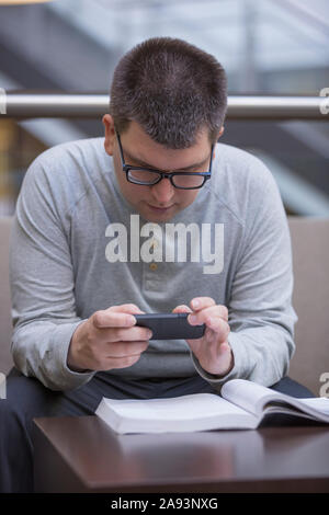 Man with Visual Impairment studying at school Stock Photo