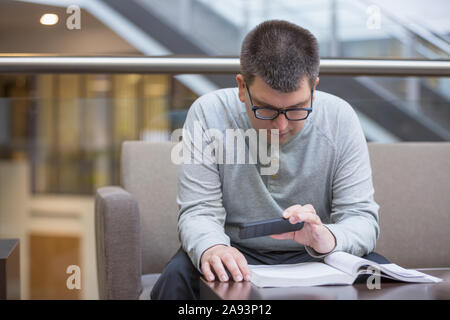 Man with Visual Impairment studying at school Stock Photo