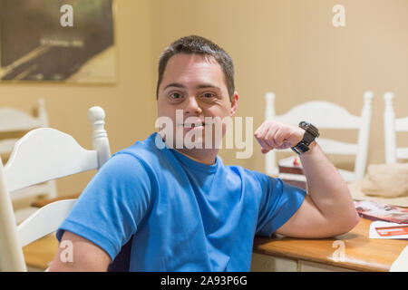 Portrait of a happy man with Down Syndrome Stock Photo
