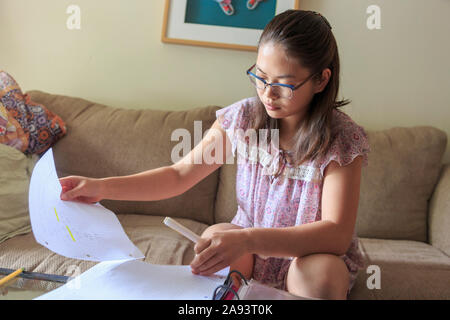 Teenage girl who has Learning Disability studying Stock Photo