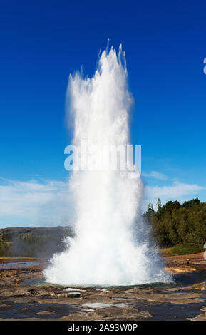 Strokkur Geyser erupting in Geysir Hot Spring area along the Golden Circle drive in Haukadalur valley in southwestern, Iceland Stock Photo