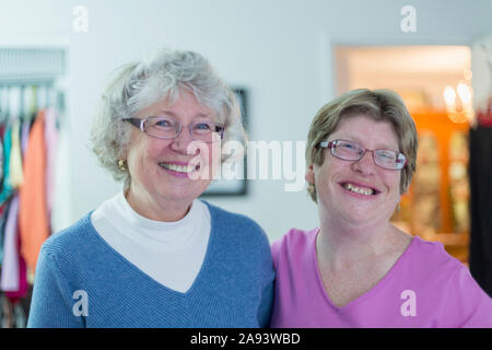 Woman with Autism smiling with her mother Stock Photo