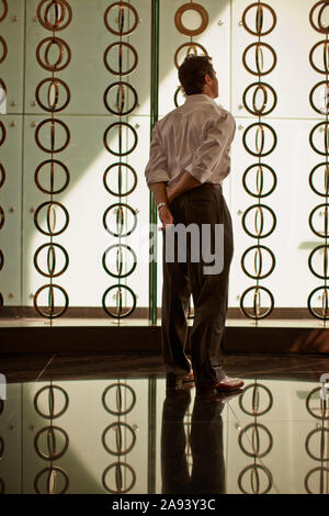 Thoughtful businessman standing in an office. Stock Photo