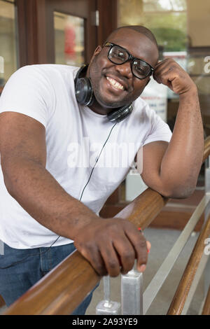 Man with ADHD wearing headphones Stock Photo