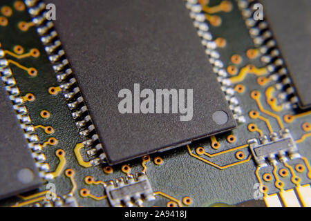 Memory microchip on the printed circuit board. Extreme close up photo. Stock Photo