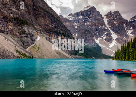 Turquoise water of a tranquil lake in the Rocky mountains, Jasper National Park; Alberta, Canada Stock Photo