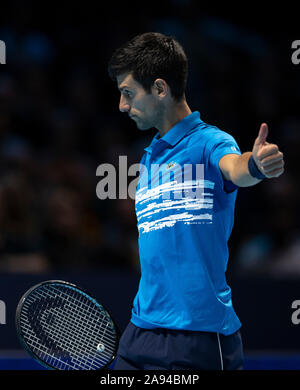 London, UK. 12th Nov, 2019. Novak Djokovic of Serbia reacts during the singles group match against Dominic Thiem of Austria at the ATP World Tour Finals 2019 in London, Britain on Nov. 12, 2019. Credit: Han Yan/Xinhua/Alamy Live News Stock Photo