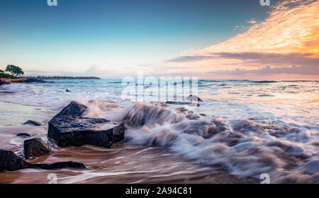 Sunrise over the pacific ocean viewed from Lydgate beach; Kapaa, Kauai, Hawaii, United States of America Stock Photo