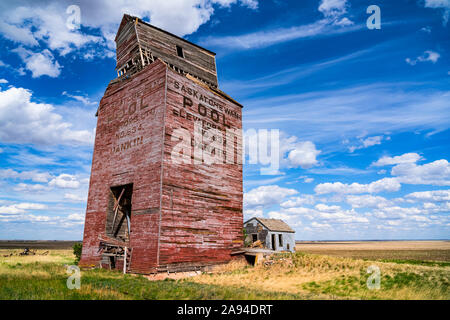 Weathered red grain elevator on the prairies; Dankin, Saskatchewan, Canada Stock Photo