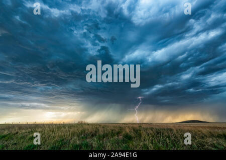 Lightning strike on the horizon during an electrical storm on the prairies; Saskatchewan, Canada Stock Photo