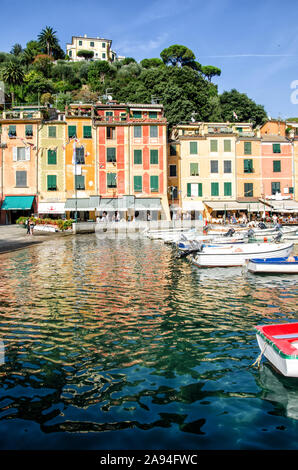 Italy, Portofino - October 3, 2014: Boats on water in the picturesque bay of Portofino with the view over the colorful houses Stock Photo