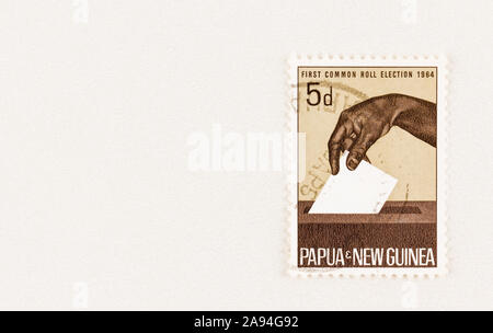 SEATTLE WASHINGTON - October 5, 2019: Postage stamp commemorating the First Common Roll Election in Papua New Guinea in 1964. Scott # 182 stamp. Stock Photo