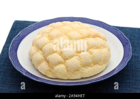 Japanese meronpan bread on dish on table Stock Photo