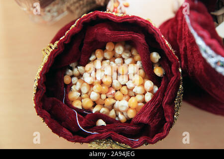 corn seeds . Corn seeds in burlap . Close up dry corn kernels in hemp sacks, taoke a photo on top view . tasacks with autumn agricultural harvest - Stock Photo