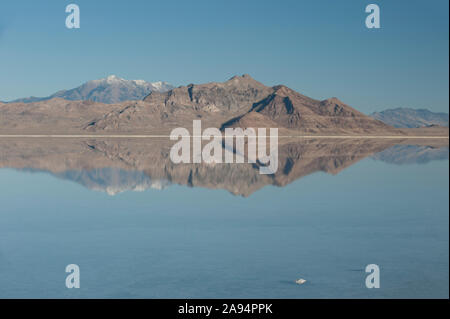 On a fine, crisp autumn morning - the famed Bonneville Salt Flats are under water, and Pilot Peak has a dusting of snow. Stock Photo