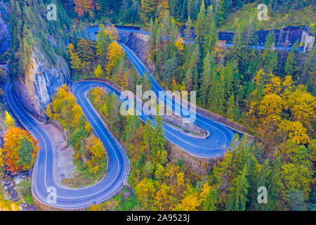 Uphill winding road in autumn mountain. Bicaz Gorges are a mountain pass between two historic regions in Romania.