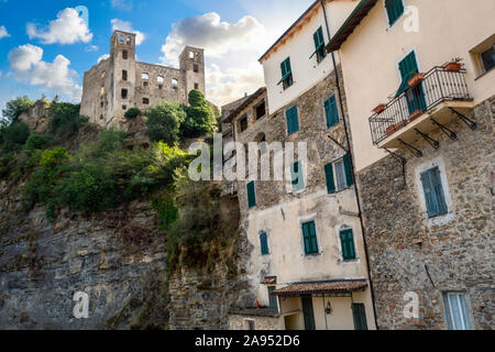 The ancient hilltop castle above the medieval stone village in the Ligurian section of Italy at Dolceacqua. Stock Photo