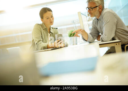 Informal business meeting between work colleagues Stock Photo