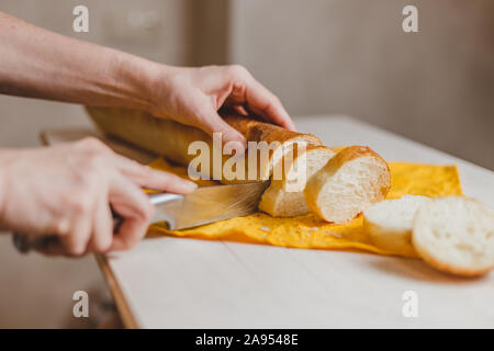 Pumpkin sandwiches with white cream cheese and green avocado on a fresh baguette - home recipe for making bruschetta Stock Photo