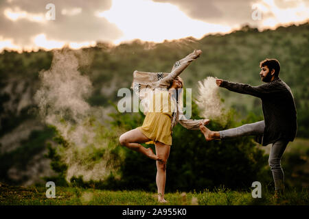 Two athletic young dancers making a performance at mountain Stock Photo