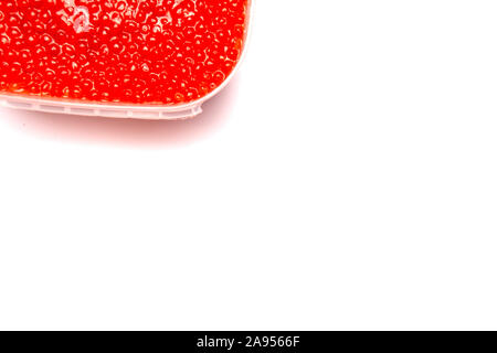 Red caviar in a jar on a white background. Stock Photo