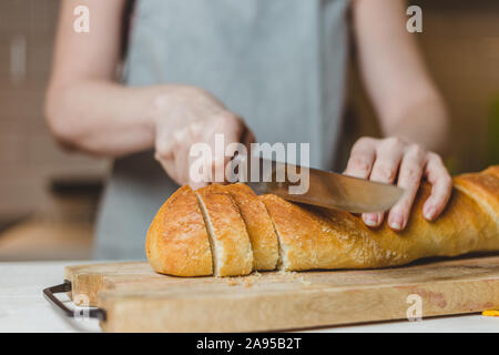 Pumpkin sandwiches with white cream cheese and green avocado on a fresh baguette - home recipe for making bruschetta Stock Photo