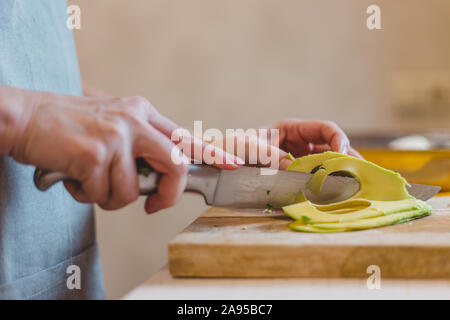 Pumpkin sandwiches with white cream cheese and green avocado on a fresh baguette - home recipe for making bruschetta Stock Photo