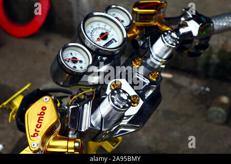 ANTIPOLO CITY, PHILIPPINES – NOVEMBER 8, 2019: Stripped down modified motorcycle at a garage. Stock Photo