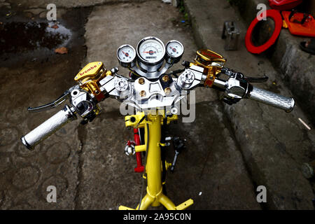 ANTIPOLO CITY, PHILIPPINES – NOVEMBER 8, 2019: Stripped down modified motorcycle at a garage. Stock Photo