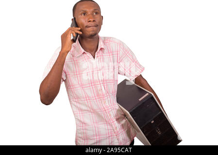 young technician with computer in hands and talking on the phone Stock Photo