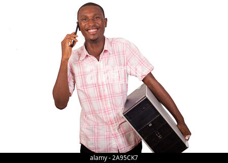 young technician with computer in hands and talking on the phone Stock Photo