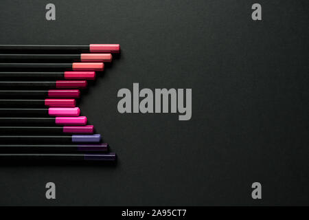 Red gradient of pencils on black background Stock Photo