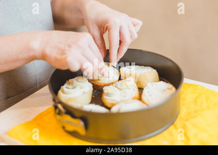 Pumpkin sandwiches with white cream cheese and green avocado on a fresh baguette - home recipe for making bruschetta Stock Photo