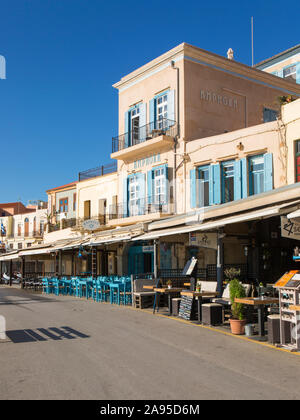 Chania, Crete, Greece. Colourful waterfront hotels and cafes lining the Venetian Harbour. Stock Photo