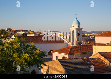 Chania, Crete, Greece. View over Old Town rooftops from the Siavo Bastion, sunset, bell-tower of the Catholic cathedral prominent.
