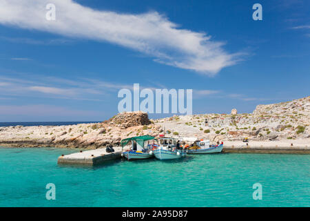 Imeri Gramvousa, Chania, Crete, Greece. Fishing boats moored alongside jetty in Gramvousa Bay. Stock Photo