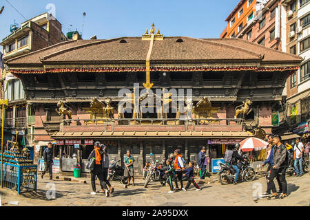 The temple of Akash Bhairav in the middle of busy Indrachok, one of the ceremonial and market squares in historic section of Kathmandu, Nepal Stock Photo