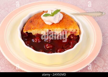 Swabian dessert, cherry smiley, sweet sponge cake with cherries, cream, baking tin, plate, Germany Stock Photo