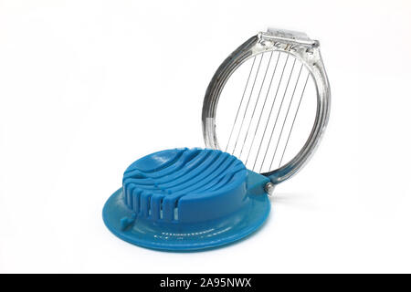 Blue plastic egg cutter, isolated on white background, close-up Stock Photo