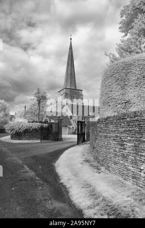 Black & white image of the parish church of All Saints in the cotswold village of Kemble in Gloucestershire Stock Photo