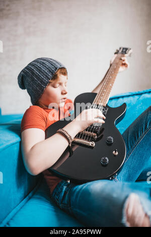 Rock and roll kid guitar player Stock Photo