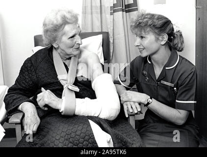 Nurse & elderly woman, City Hospital, Nottingham UK 1991 Stock Photo