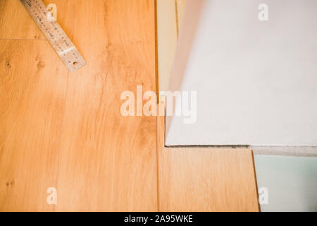 Difficult configuration and trimming near walls - floor coverings - floating floor Stock Photo