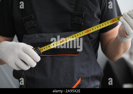 Man holding measuring device Stock Photo