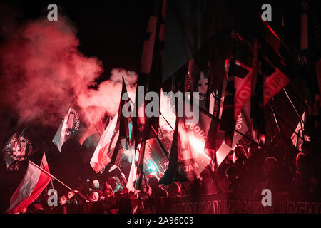 Marchers burn flares as they take part in the annual March of Independence organized by far right activists to celebrate 101 years of Poland's indepen Stock Photo