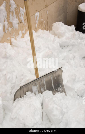 snow removal with a snow shovel in the winter time snow removal with ...