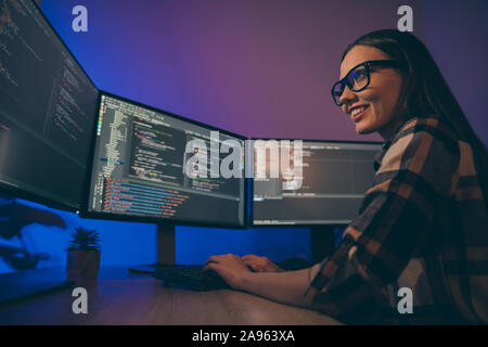 Low below angle view photo of cheerful woman finishing developing computer game solving all the current problems Stock Photo