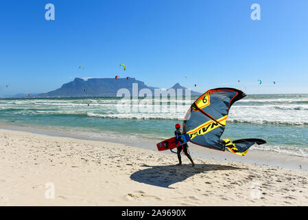 A  Kite surfer walking on the beach in Cape Town, South Africa Stock Photo