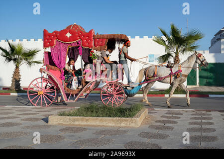 Asilah, Morocco-September 10, 2019: Horse carriage  riding around with tourists in the village Asilah, Morocco Stock Photo